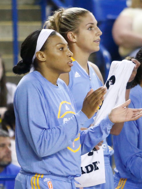 Chicago Sky's Betnijah Laney (left), a former Smyrna High and Rutgers star, and Elena Delle Donne (Ursuline, Delaware) cheer their team in a timeout in the first half of a WNBA preseason game against the New York Liberty at the Bob Carpenter Center Friday.