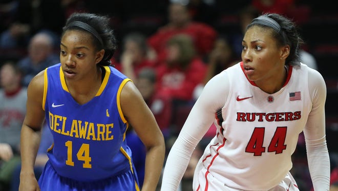 Alecia Bell lines up for a foul shot next to Rutgers Betnijah Laney, a Smyrna High grad now playing in the WNBA, in the teams' 2014 WNIT game.