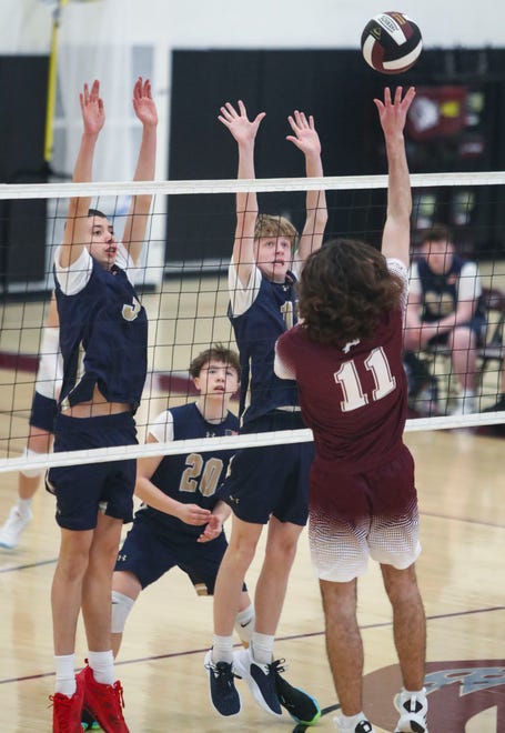 Delaware Military's (from left) Paxton Ayers, Wesley Ferro and Owen Mast defend against a kill attempt by Appoquinimink's Dylan Clark (11) in the Jaguars' 3-0 win at Appoquinimink, Wednesday, March 27, 2024.