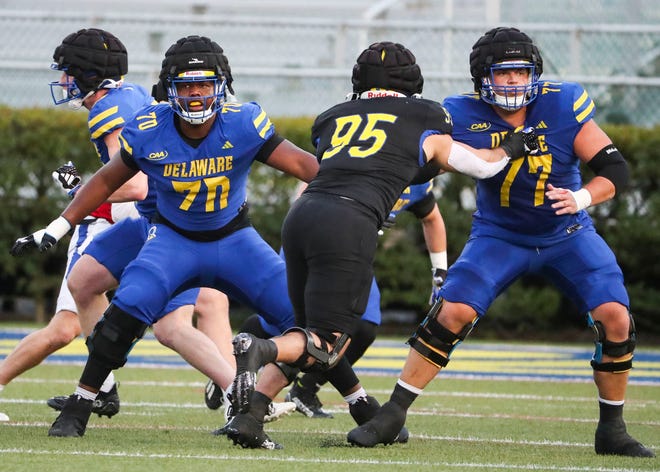 Delaware offensive linemen Anwar O'neal (70) and Cole Snyder (77) block Melkart Abou-Jaoude during the Blue and White Spring Game at Delaware Stadium, Friday, April 19, 2024.