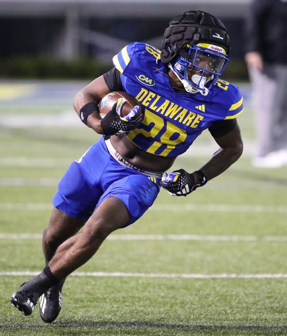 Delaware running back Saeed St. Fleur carries during the Blue and White Spring Game at Delaware Stadium, Friday, April 19, 2024.