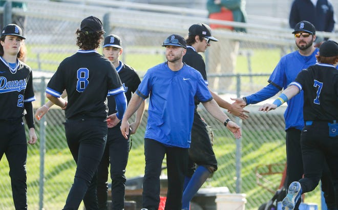 Brandywine head coach Mike Julian (center) greets his team as they come off the field in the sixth inning of Concord's 3-1 win at Brandywine High School, Tuesday, April 23, 2024.