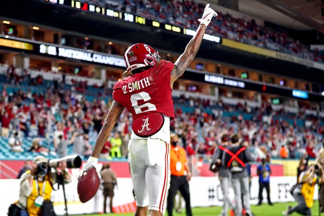 Alabama wide receiver DeVonta Smith celebrates after scoring a touchdown during the second quarter.