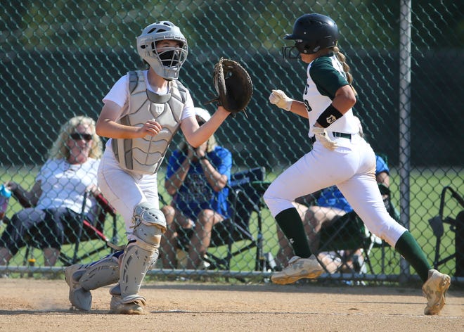 St. Mark's Pia Perrone scores ahead of the throw as Charter School of Wilmington catcher Cecilia Johnston waits in the second inning of the Spartans'  4-0 win in the second round of the DIAA state high school tournament Wednesday, May 19, 2021 at St. Mark's High School.