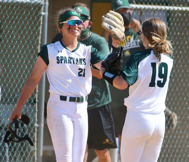 St. Mark's starter Ryleigh Thomas (left) greets teammate Amanda Oller after dispatching Charter School of Wilmington in the second inning of St. Mark's 4-0 win in the second round of the DIAA state high school tournament Wednesday, May 19, 2021 at St. Mark's High School.