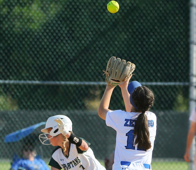 Charter's Cassidy Zelano waits on a pop fly as St. Mark's Sophia Wenger scrambles to get back to first in the sixth inning of the Spartans'  4-0 win in the second round of the DIAA state high school tournament Wednesday, May 19, 2021 at St. Mark's High School.