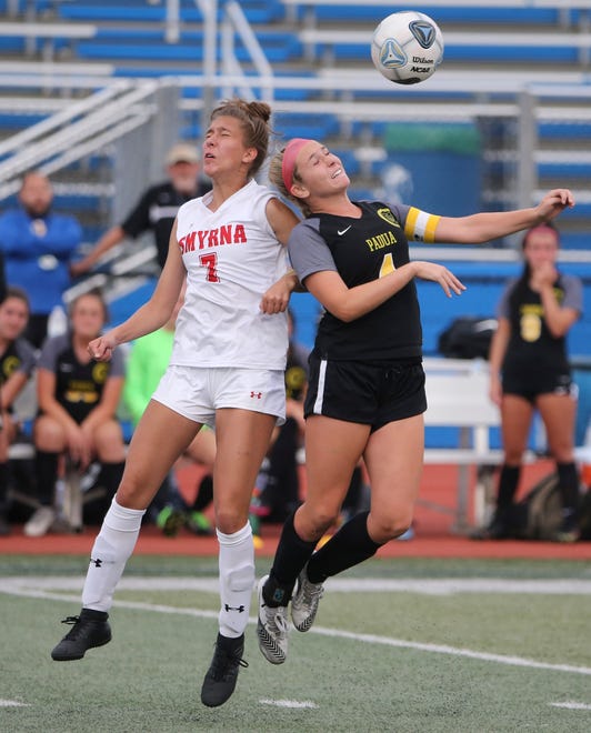 Smyrna's Alyssa McLamb (left) and Padua's Sophia Marini leap for a header in the second half of Padua's 2-1 win in the DIAA Division I state tournament title game Tuesday, June 1, 2021 at Dover High School.