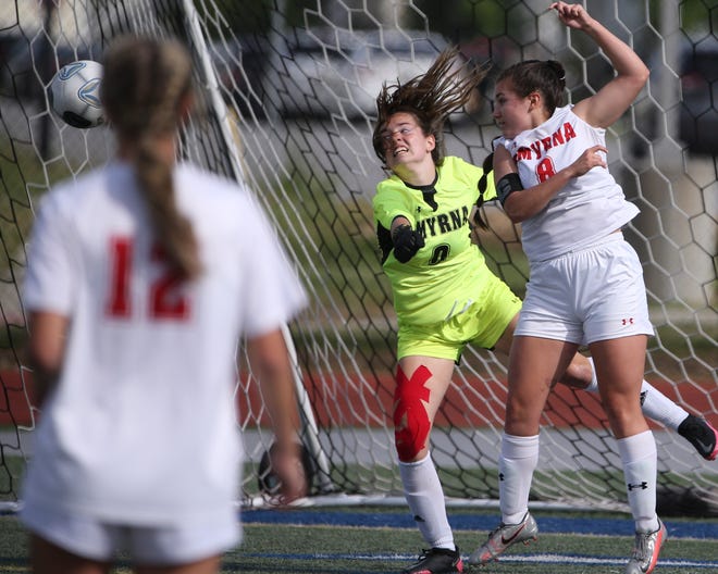 Smyrna keeper Sofia Lerro and defender Cheyenne Donaghue move for the ball as it crosses the front of the goal in the first half of Padua's 2-1 win in the DIAA Division I state tournament title game Tuesday, June 1, 2021 at Dover High School.