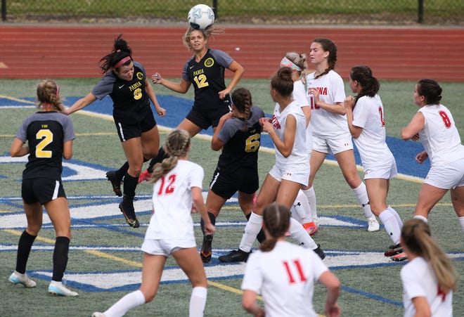 Padua's Anna Poehlmann (second from left) directs a header toward the Smyrna net in the first half of Padua's 2-1 win in the DIAA Division I state tournament title game Tuesday, June 1, 2021 at Dover High School.