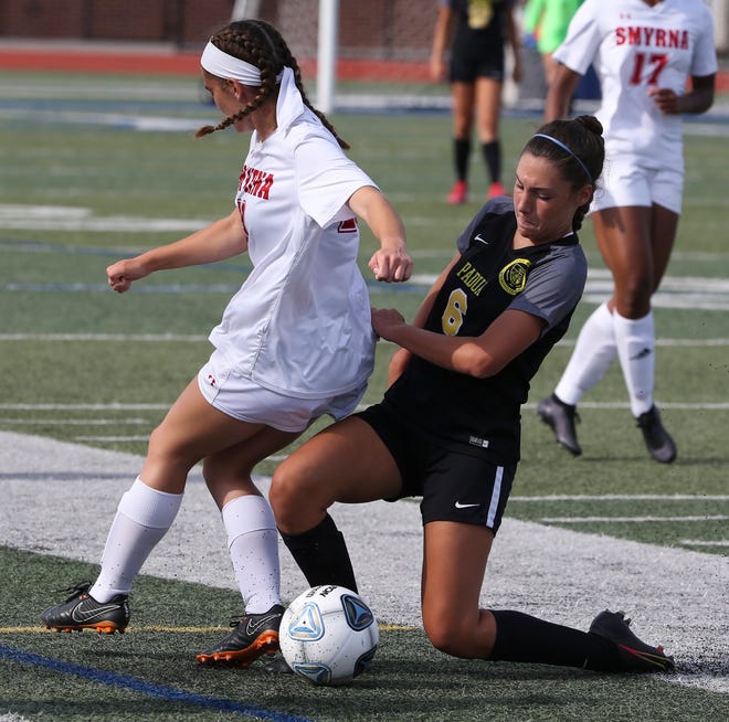 Smyrna's Dru Moffett (left) and Padua's Madison Mosier fight for the ball in the first half of Padua's 2-1 win in the DIAA Division I state tournament title game Tuesday, June 1, 2021 at Dover High School.