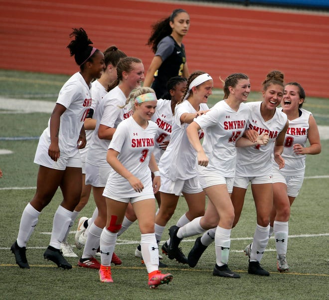 Smyrna's 	Mackenzie Martin (third from right) is the center of celebration in the first half of Padua's 2-1 win in the DIAA Division I state tournament title game Tuesday, June 1, 2021 at Dover High School.