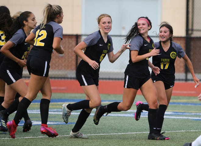 Padua's (from left) Brieana Hallo, Anna Getty, Lauren Duffy, Anna Poehlmann and Sophia Holgado celebrate Poehlmann's go-ahead goal late in the second half of Padua's 2-1 win in the DIAA Division I state tournament title game Tuesday, June 1, 2021 at Dover High School.