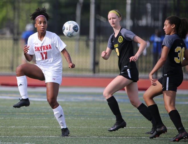 Smyrna's Desiree Zapata (left) moves for the ball against Padua's Morgan Dawson (8) and Sydni Wright in the first half of Padua's 2-1 win in the DIAA Division I state tournament title game Tuesday, June 1, 2021 at Dover High School.