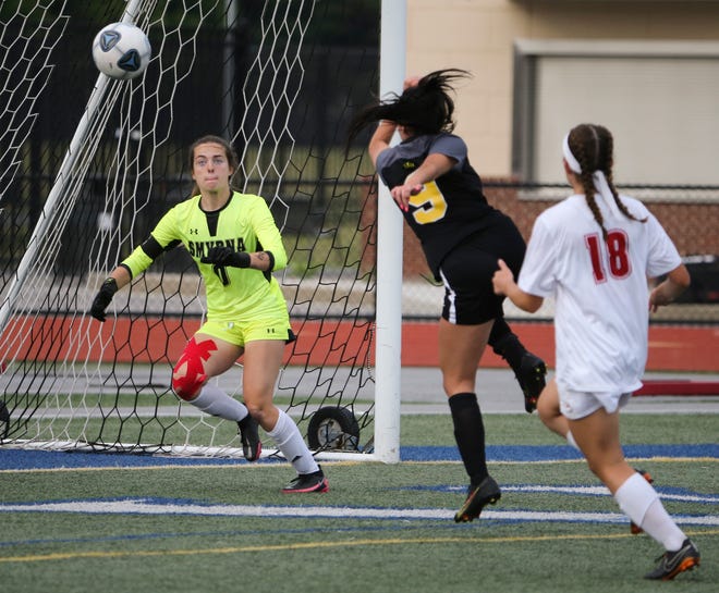 Padua's Anna Poehlmann (9) one-times a crossing pass into the net past Smyrna goalkeeper Sofia Lerro for the deciding goal late in the second half of Padua's 2-1 win in the DIAA Division I state tournament title game Tuesday, June 1, 2021 at Dover High School.