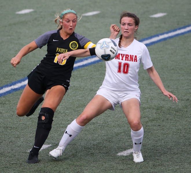 Padua's Haley Dougherty (left) and Smyrna's Hannah Osborne go for the ball in the first half of Padua's 2-1 win in the DIAA Division I state tournament title game Tuesday, June 1, 2021 at Dover High School.