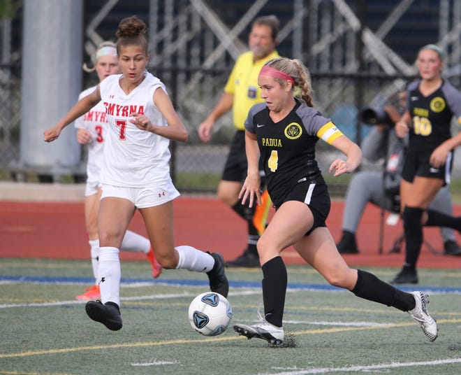 Smyrna's Alyssa McLamb (left) sticks with Padua's Sophia Marini in the second half of Padua's 2-1 win in the DIAA Division I state tournament title game Tuesday, June 1, 2021 at Dover High School.