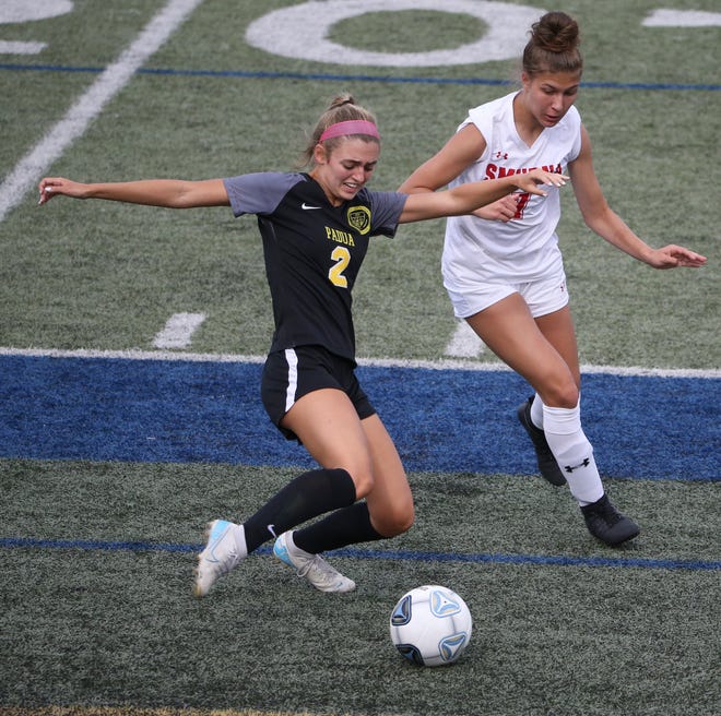 Padua's Skylar Salvo (left) tries to get the ball past Smyrna's Alyssa McLamb in the first half of Padua's 2-1 win in the DIAA Division I state tournament title game Tuesday, June 1, 2021 at Dover High School.