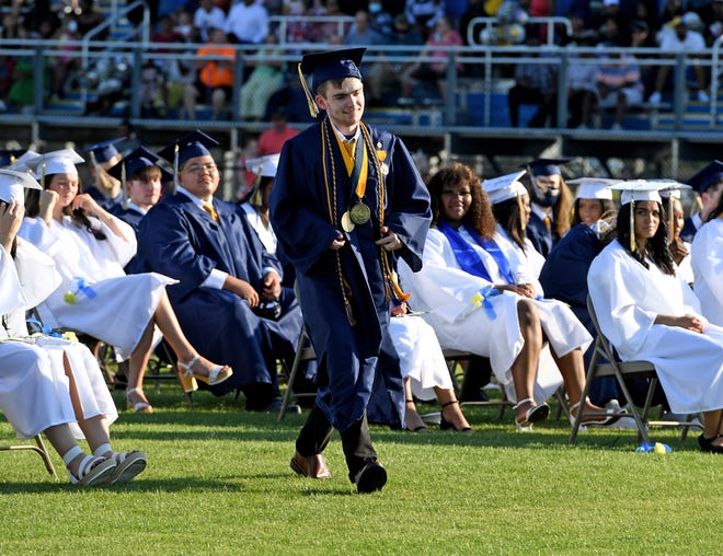 Seaford High School Valedictorian Nicholas Phillips walks to the stage to give his address during commencement Monday, June 7, 2021, at Bob Dowd Stadium in Seaford, Delaware.