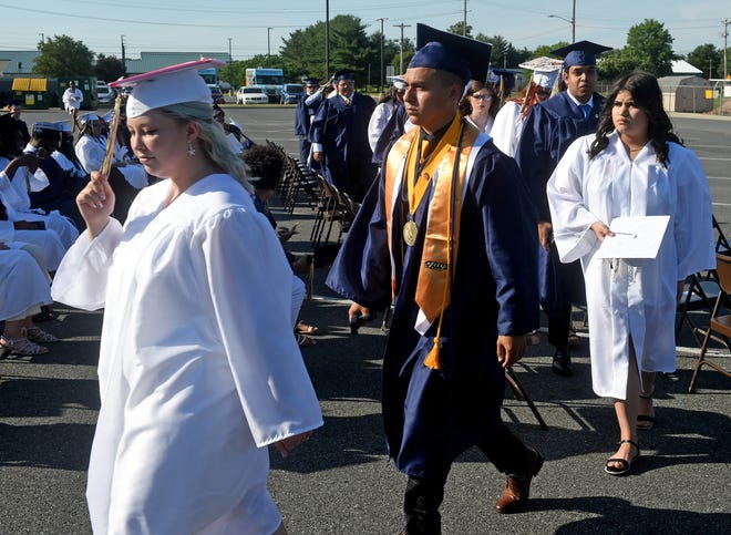 Seaford High School seniors head inside the high school to wait for the start of commencement Monday, June 7, 2021, at Bob Dowd Stadium in Seaford, Delaware.