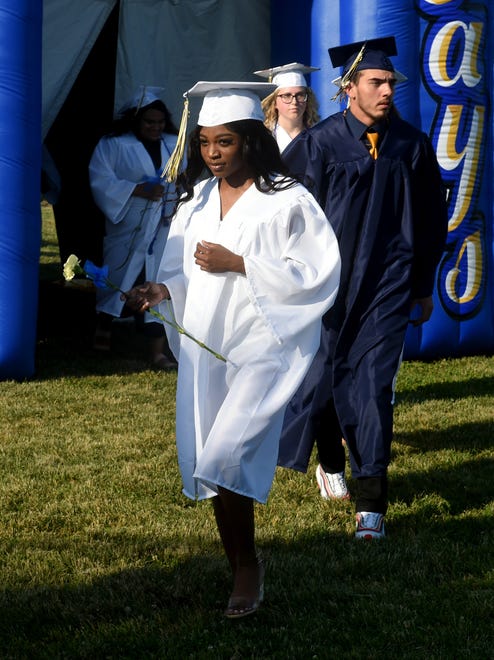 Seaford High School seniors head to their seats during the processional Monday, June 7, 2021, at Bob Dowd Stadium in Seaford, Delaware.