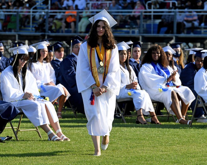 Seaford High School Salutatorian Jessica Castro-Sandoval walks to the stage to give her address during commencement Monday, June 7, 2021, at Bob Dowd Stadium in Seaford, Delaware.
