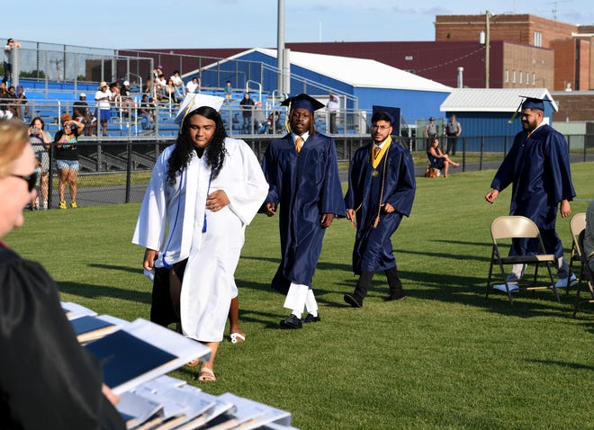 Seaford High School seniors head to their diplomas before crossing the stage for commencement Monday, June 7, 2021, at Bob Dowd Stadium in Seaford, Delaware.