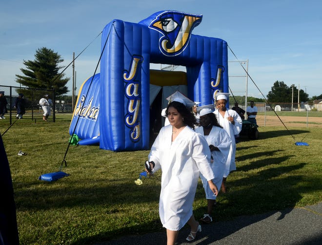 Seaford High School seniors head to their seats during the processional Monday, June 7, 2021, at Bob Dowd Stadium in Seaford, Delaware.
