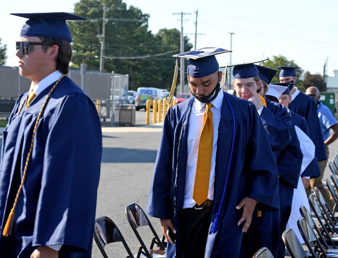 Seaford High School seniors head inside the high school to wait for the start of commencement Monday, June 7, 2021, at Bob Dowd Stadium in Seaford, Delaware.