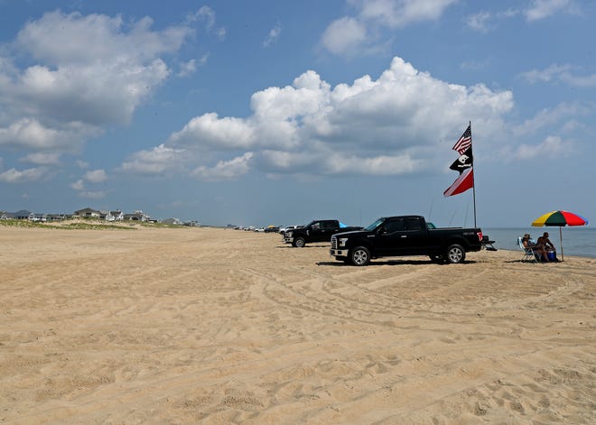 Surf fisher line up along the beach Friday, July 16, 2021, on Fenwick Island State Park in Fenwick Island, Delaware.