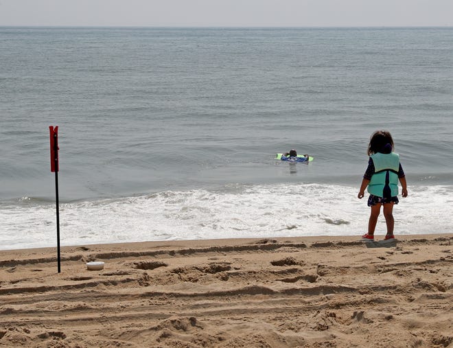 People play in the surf fishing area Friday, July 16, 2021, on Fenwick Island State Park in Fenwick Island, Delaware.