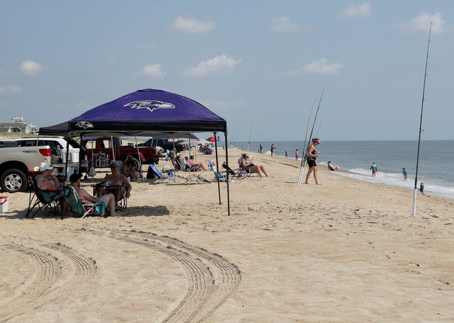 Surf fishermen line up along the beach at Fenwick Island State Park in Delaware.