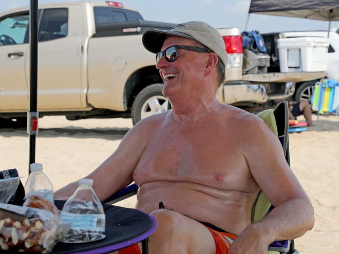 Dan Nickel laughs while being interviewed on as a surf fisher Friday, July 16, 2021, on Fenwick Island State Park in Fenwick Island, Delaware.