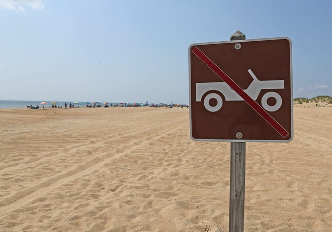 A sign denotes where cars are not allowed on the beach Friday, July 16, 2021, on Fenwick Island State Park in Fenwick Island, Delaware.